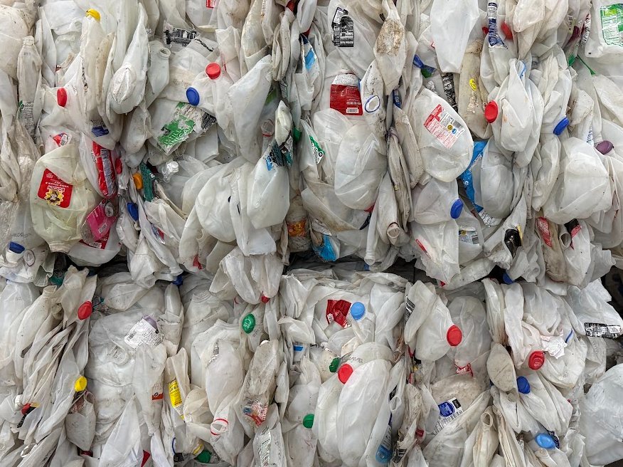 Bales of recovered plastic containers prepared for recycling