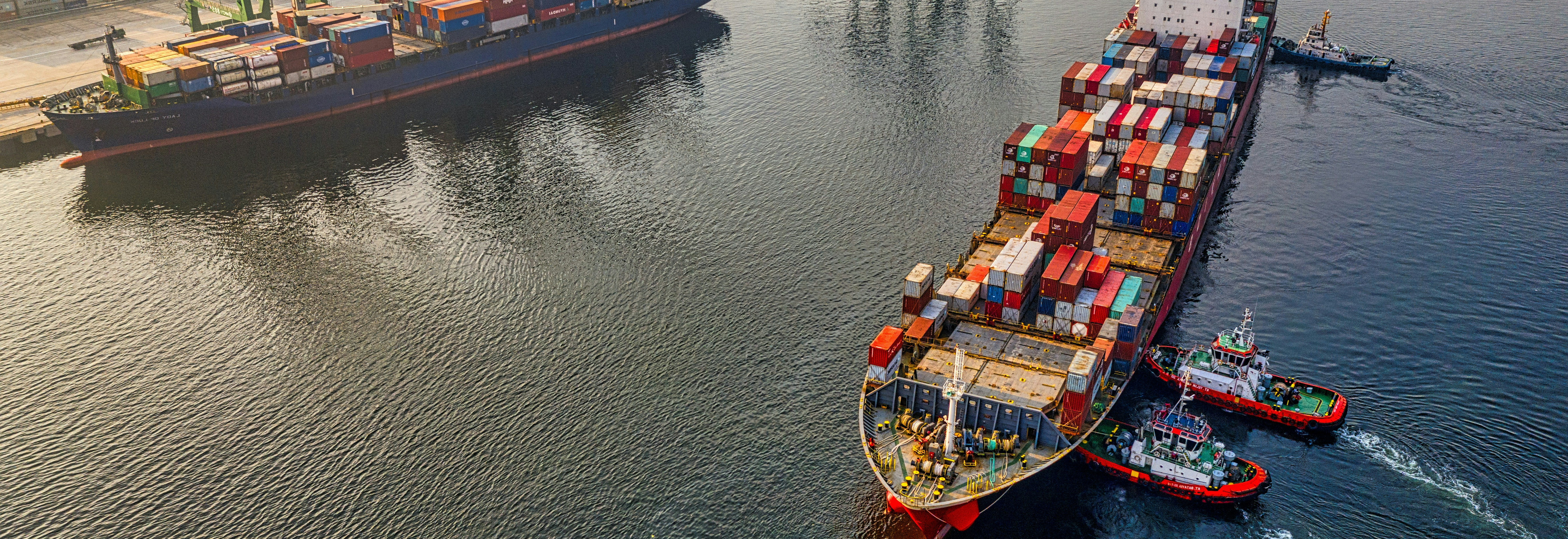 Container vessel and shipping containers at a commercial port