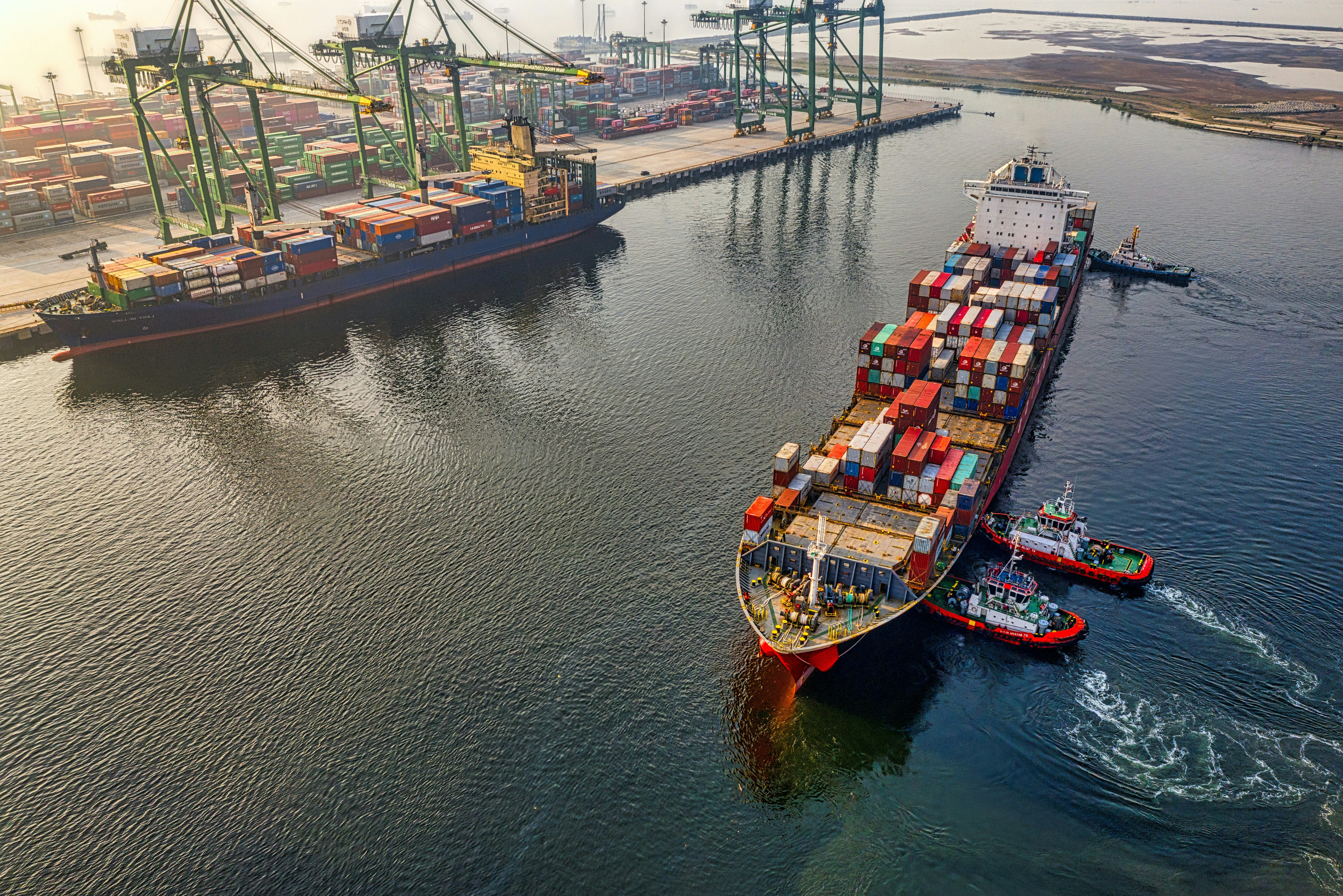 Container vessel and shipping containers at a commercial port